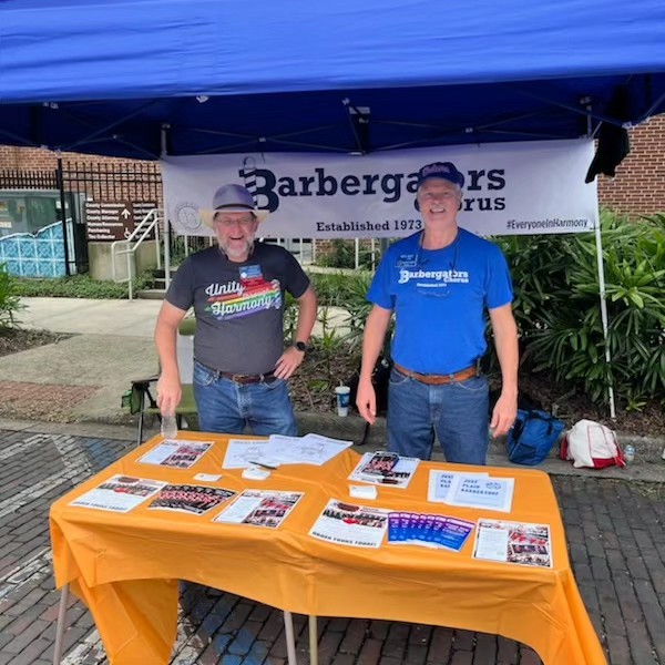 Dave and Steve at the Barbergators tent, with our new banner