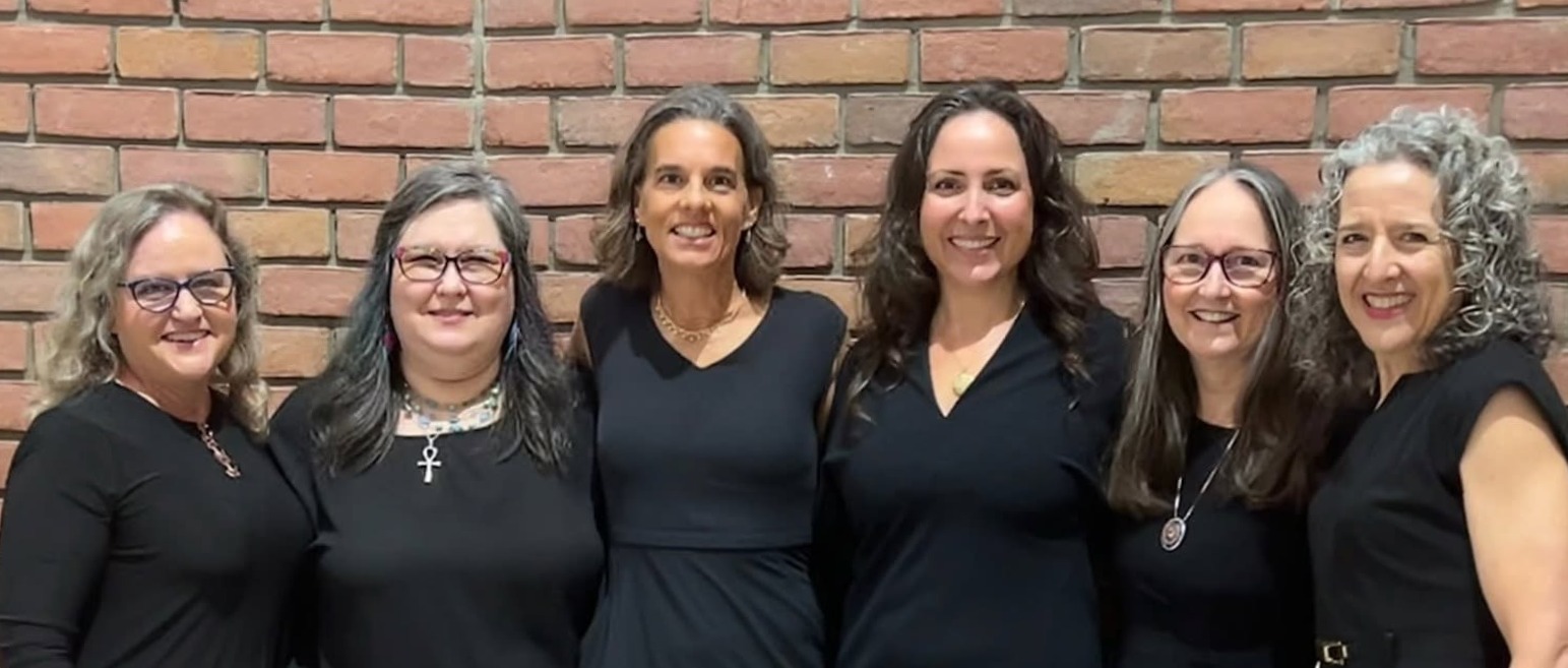 Resonance, a six woman a cappella group. photo of them all wearing black dresses